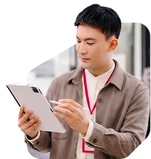 A man signing on a tablet with a stylus