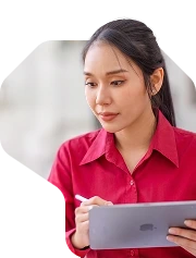 A woman reviewing a document on a tablet